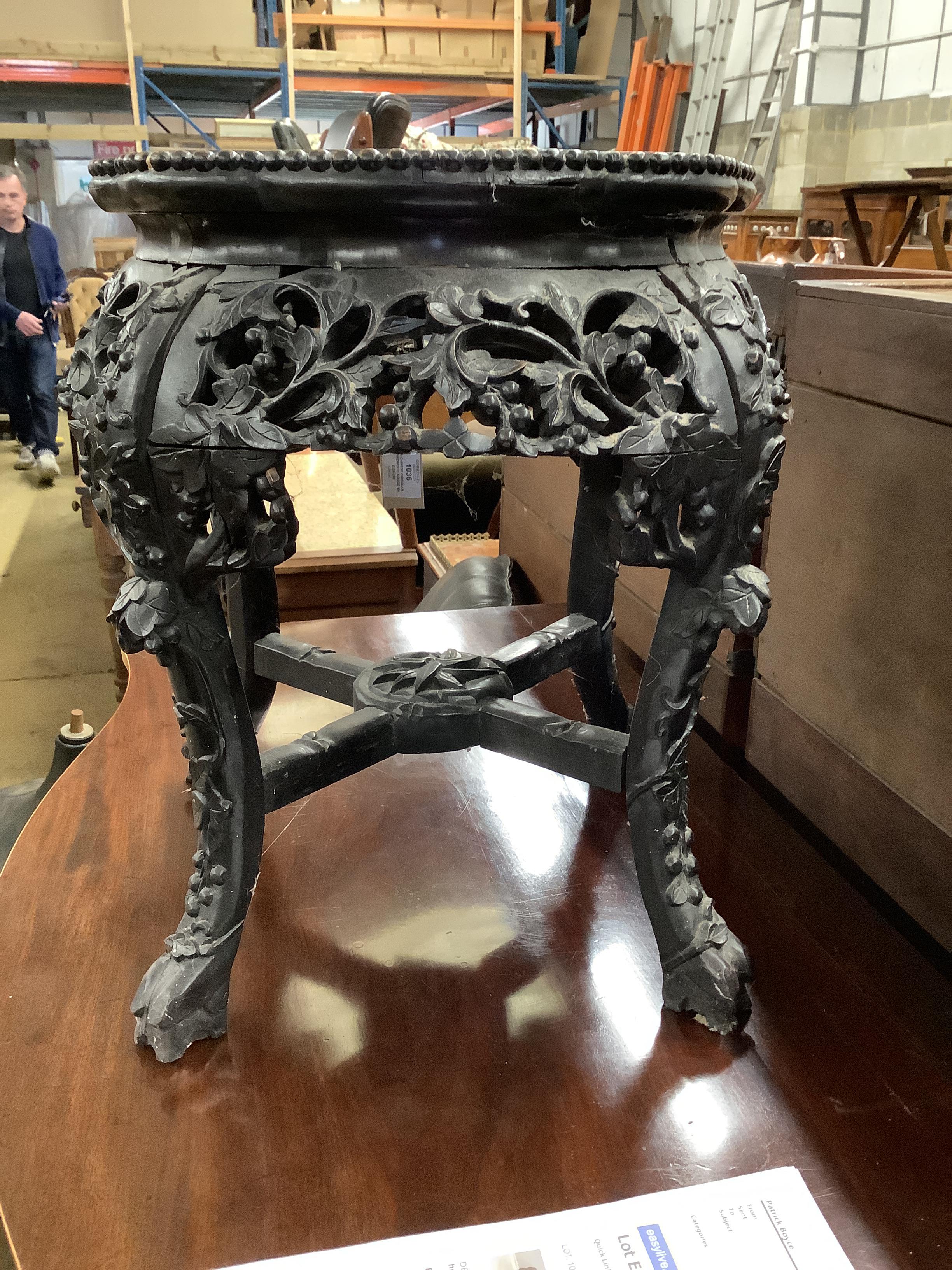 A Chinese circular hardwood rouge marble topped jardiniere stand, diameter 42cm, height 47cm